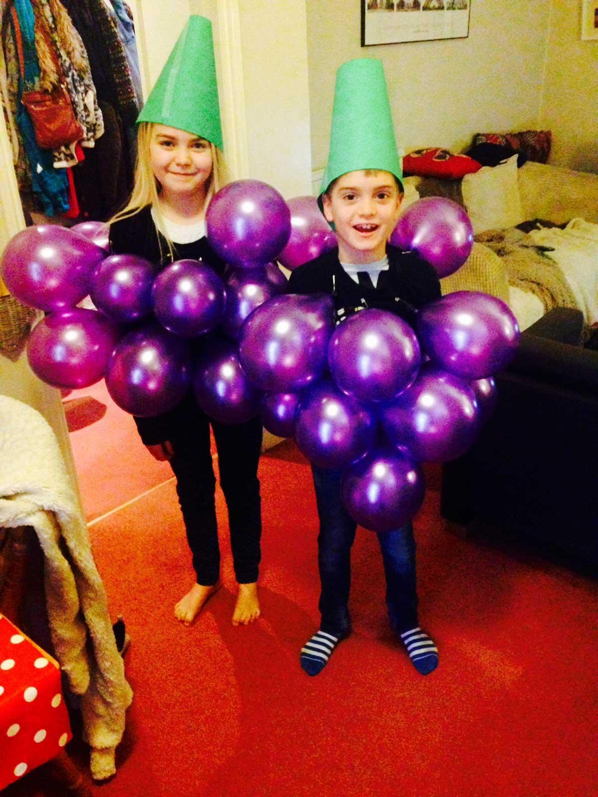 Lola and Louie dressed as grapes for Comic Relief