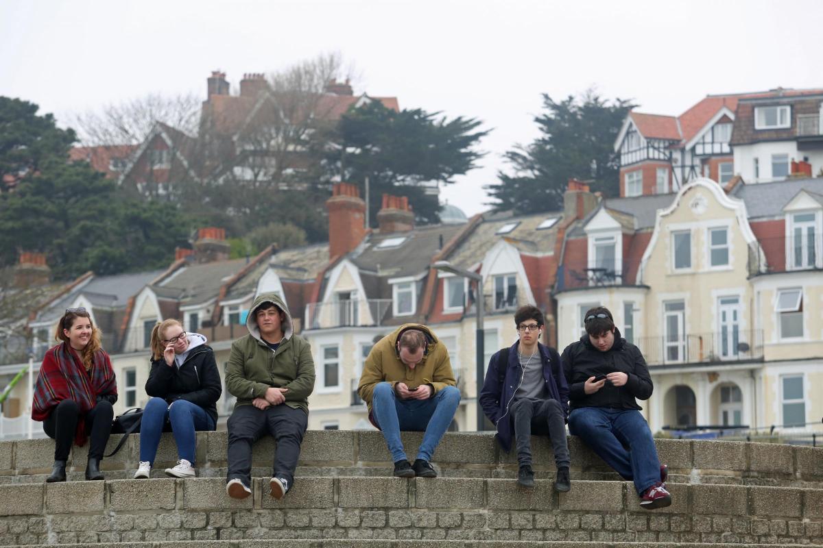 Pictures of the eclipse and people watching along Bournemouth seafront on 20th March 2015
