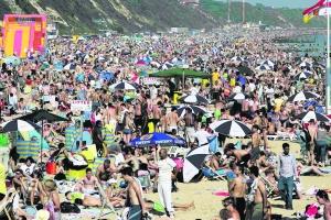 Bournemouth Echo: FULL AND FUN: A packed Bournemouth beach on Sunday afternoon