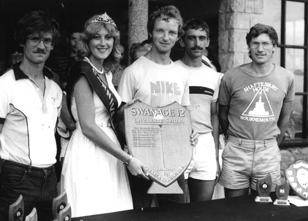Picture by Bob Richardson . Bournemouth Athletic club's winning quartet, Bob Lands, John Boyes, Brian Johnson and Harold Chadwick are pictured with Carnival Queen Mandy John and the Swanage 12 challenge shield.
