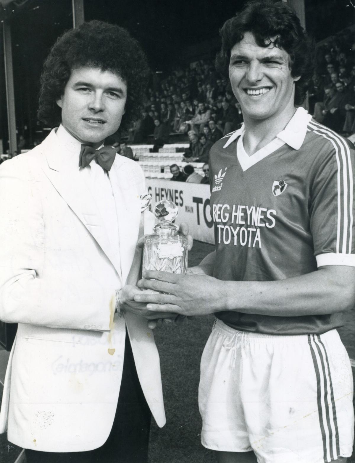 7th March 1981, Cherries captain John Impey, right, receives Mecca Loyalty Award for 200 league appearances from Joe Lucy, general manager of Tiffany's.  A selection of the images that are featured in the Daily Echo, AFC Bournemouth Photographic Book. 