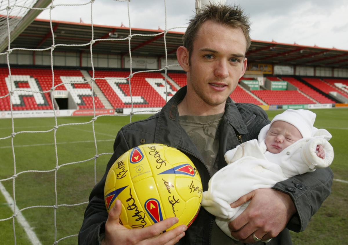 James Hayter with their son Harris the day after he scored a hat-trick in record time Feb 2004.  A selection of the images that are featured in the Daily Echo, AFC Bournemouth Photographic Book.