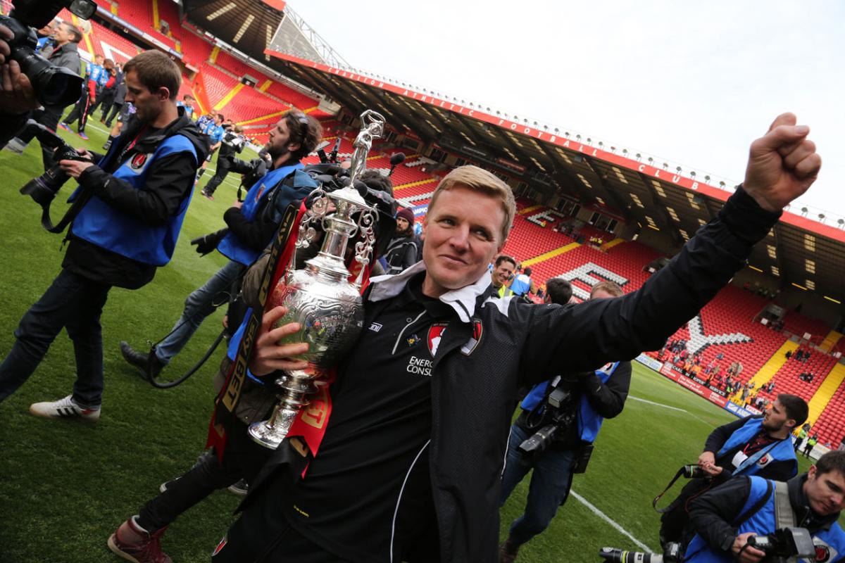 Eddie Howe, not letting go of that Championship League cup. A selection of the images that are featured in the Daily Echo, AFC Bournemouth Photographic Book. 