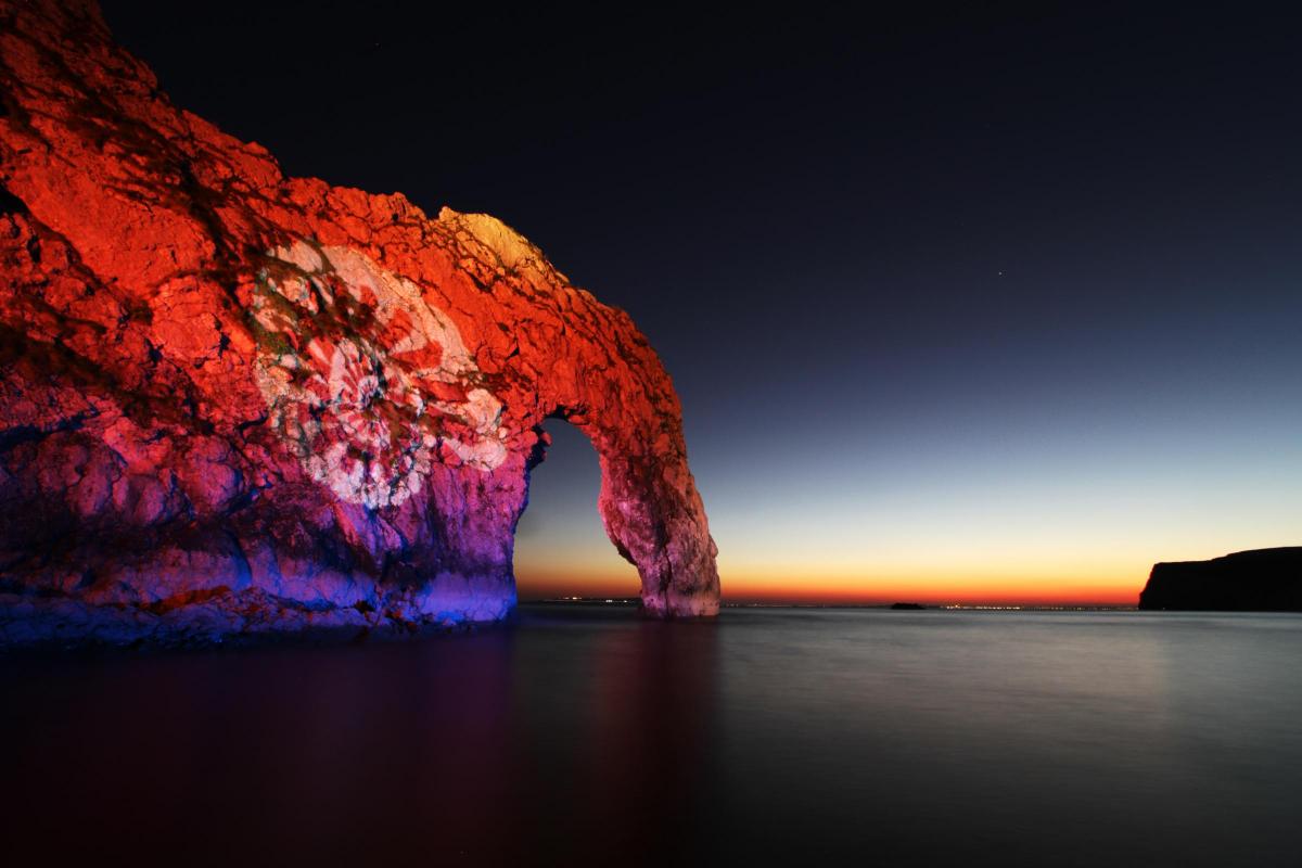 Durdle Door was illuminated for one night only as part of the Night of Heritage Light event. By Nigel Hunter