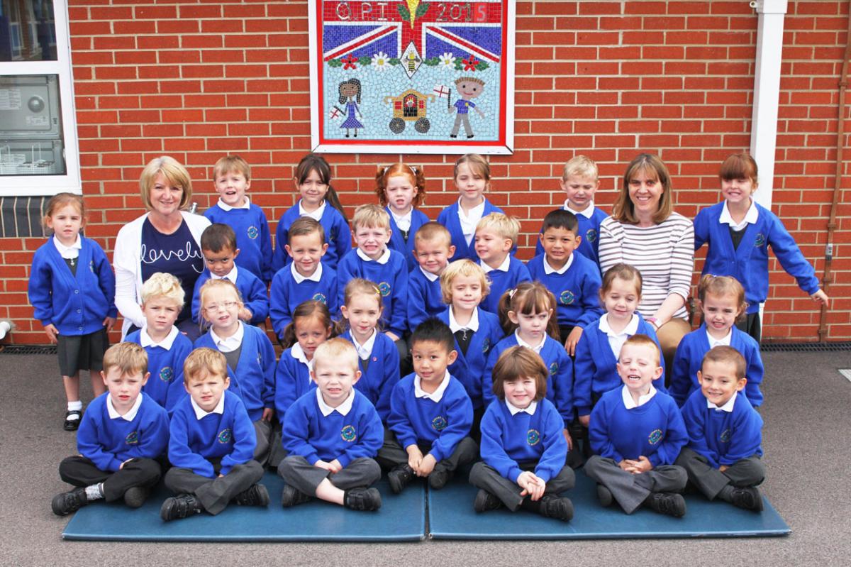 Kingfisher classat  Queens Park Infant Academy, with  teacher Mrs Sara Adeney, right, and TA Mrs Wendy Druce, left.