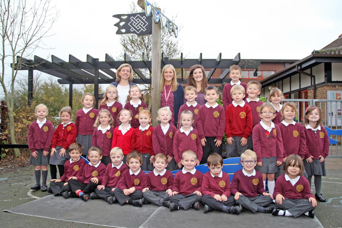Honeybee class at Lytchett Matravers Primary School with teacher Sophie Barker, back centre, TA Amy Coombs, back right and one to one TA Nicola Goss, back left.