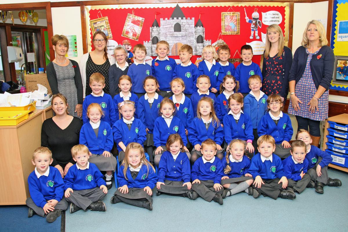 Rabbits class at Upton Infant School with teacher Rox Crabb, second from left back, teacher Ros Monaghan, second from right back, TA Marion Waight, back far left, TA Ali Rawlings, far right and one to one Faye Gardener, far left middle row.