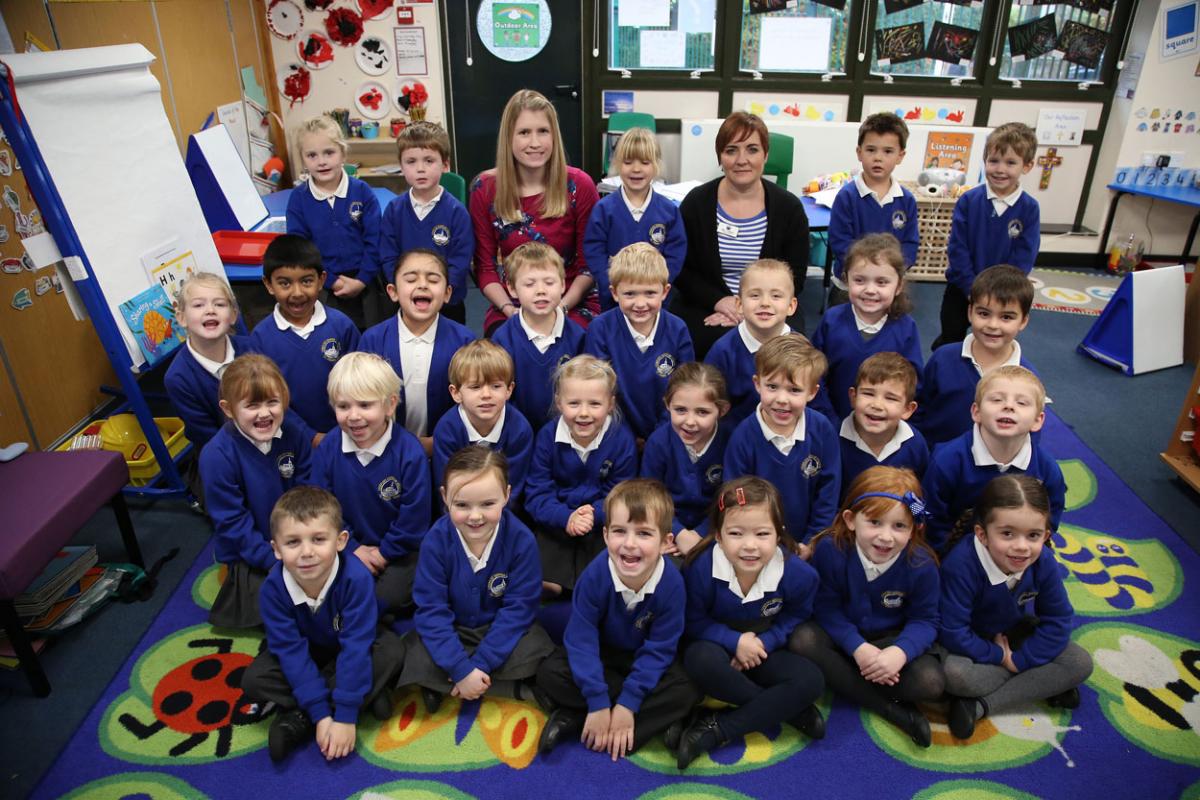 Reception class pupils at Longfleet Primary School with teacher Hannah Tansey and TA Lara Lidiard. 