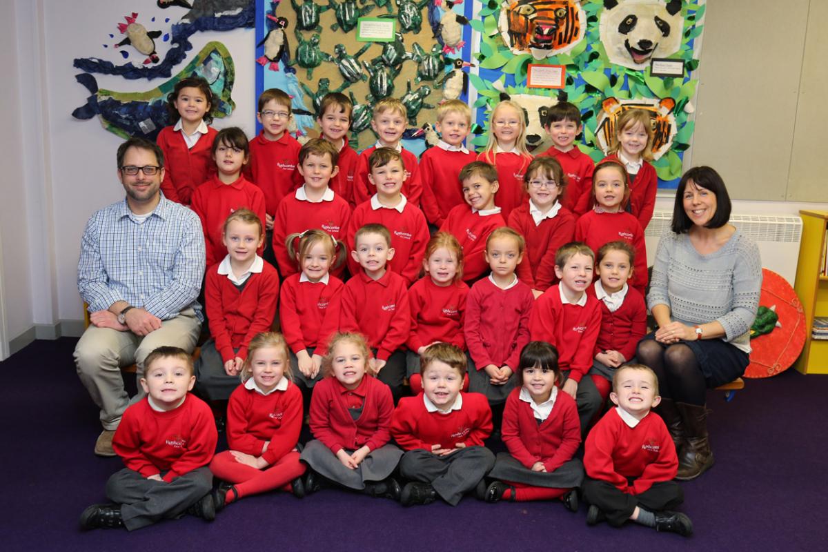 Reception children at Rushcombe First School in Corfe Mullen with Teacher Mr McCormack, left, and TA Mrs Colomb.