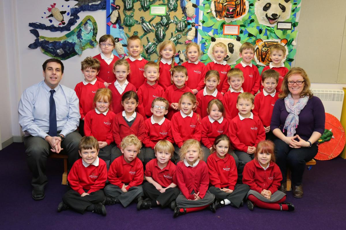 Reception children at Rushcombe First School in Corfe Mullen with Teacher Mr Smith, left, and TA Mrs Kirkland