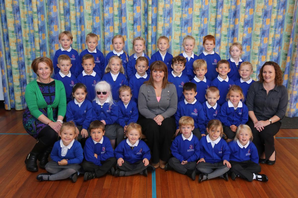 Reception children in Rose class at Heatherlands Primary school with teacher Hayley Lynam, centre, and TA's Helen Marsh and Donna Stanley.