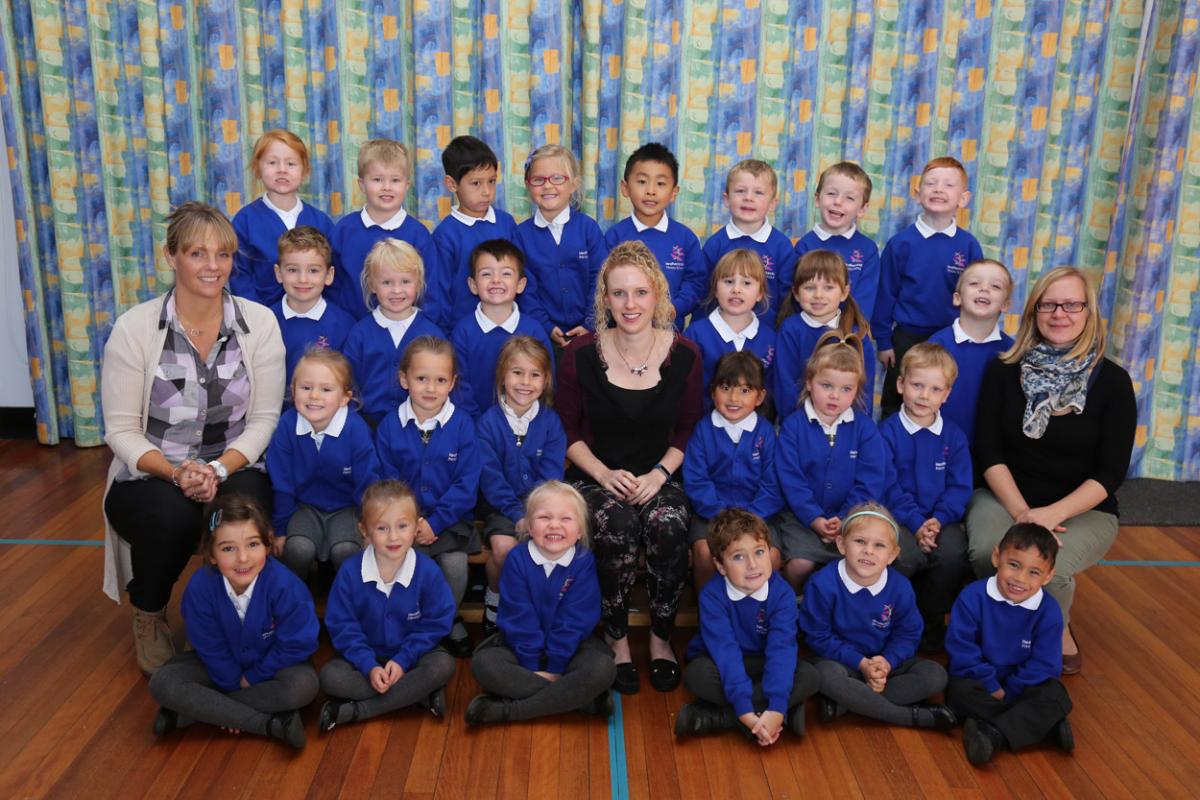Reception children in Cherry class at Heatherlands Primary school with teacher Ella Summers, centre, and TA's Anne Ray and Heather Sheldon.
