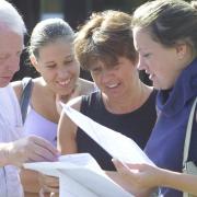 Parkstone Grammar School A-level results - Amy Stimpson from Canford Heath reads her results with her delighted mum and dad Kim and Bob and younger sister Lucy.