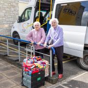 Amberwood House residents Shirley Allen, left, and Margaret Collins, arrive at the Cats Protection rehoming centre in Ferndown with a batch of knitted blankets