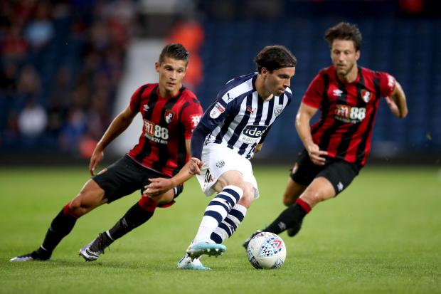 West Bromwich Albion's Filip Krovinovic (centre) battles for the ball with Bournemouth's Harry Arter (right) and Alex Dobre during the Pre Season Friendly at The Hawthorns, West Bromwich. PRESS ASSOCIATION Photo. Picture date: Friday July 26,