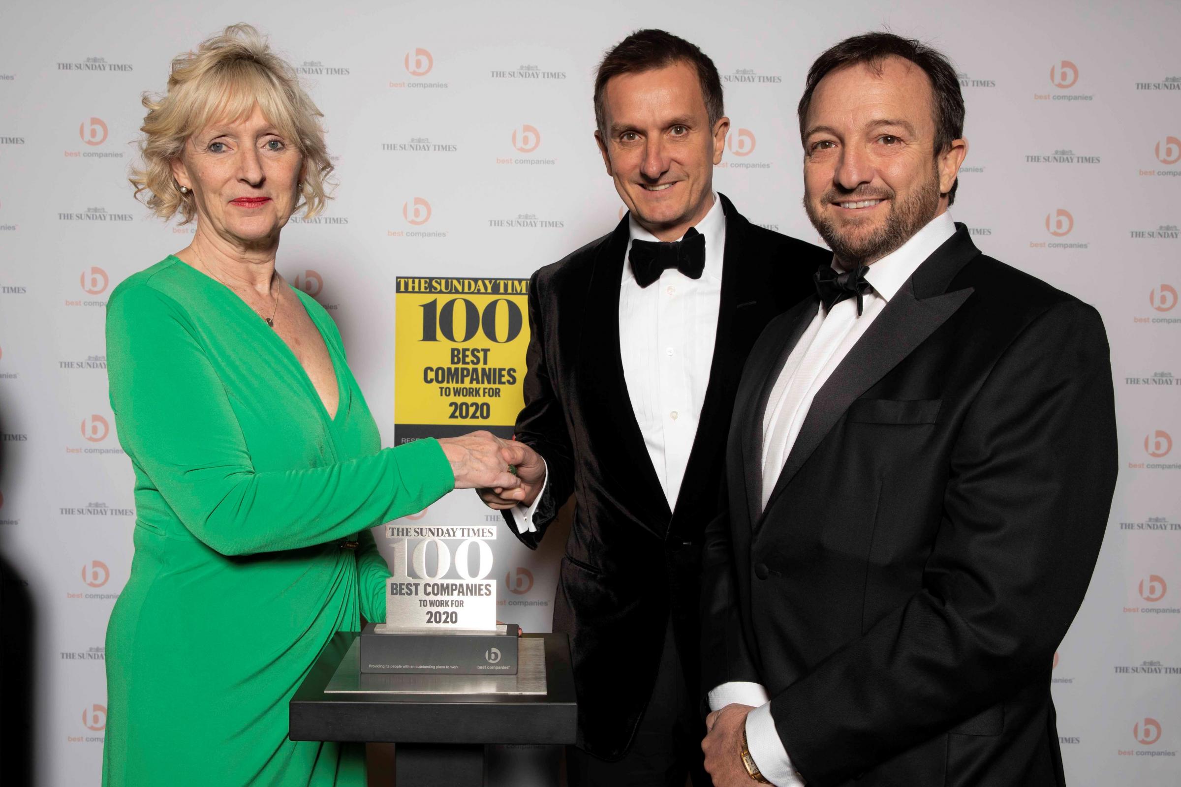 Brother Spencer McCarthy (centre) and Clinton McCarthy (right) pick up third place award at Sunday Times Top 100 Best Companies to Work For 2020