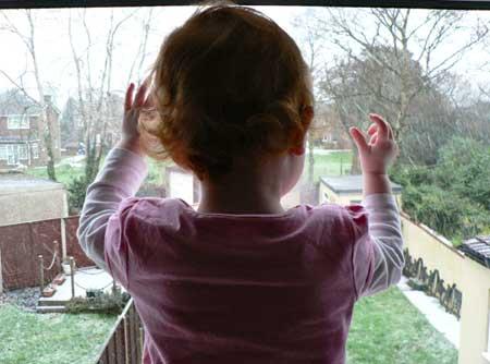 19-month-old Sophia Anne Venning looks out her bedroom window and sees snow for the first time at Northbourne, Bournemouth. Sent in by  Kresta K.C. Venning.  