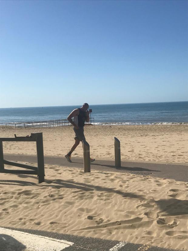 Bournemouth Echo: Tyson Fury jogging on Bournemouth beach in 2020