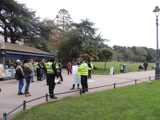 Bournemouth Echo: Police officers with a protester