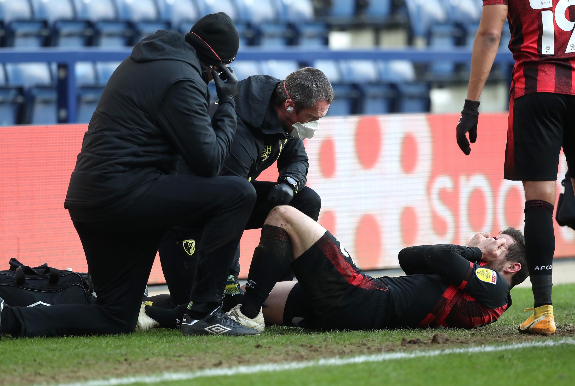 AFC Bournemouths Lewis Cook receives treatment during the Sky Bet Championship match at Deepdale, Preston. Picture date: Saturday March 6, 2021. PA Photo. See PA story SOCCER Preston. Photo credit should read: Martin Rickett/PA Wire...RESTRICTIONS: