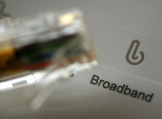 A broadband cable and router. Picture: PA