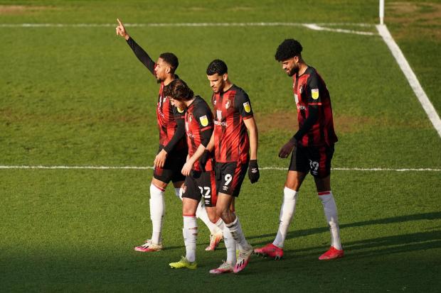 AFC Bournemouth's Arnaut Danjuma (left) celebrates scoring their second goal of the game with teammates during the Sky Bet Championship match at The Den, Millwall. Picture date: Wednesday April 21, 2021. PA Photo. See PA story SOCCER Millwall. Photo