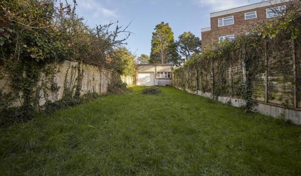 Bournemouth Echo: BNPS.co.uk (01202) 558833. 
Pic: LloydsPropertyGroup/BNPS

Pictured: The rear of the 98ft long plot. 

A run-down garage on the exclusive Sandbanks peninsula has sold for over £600,000 - 2.5 times the price of the average house in Britain.