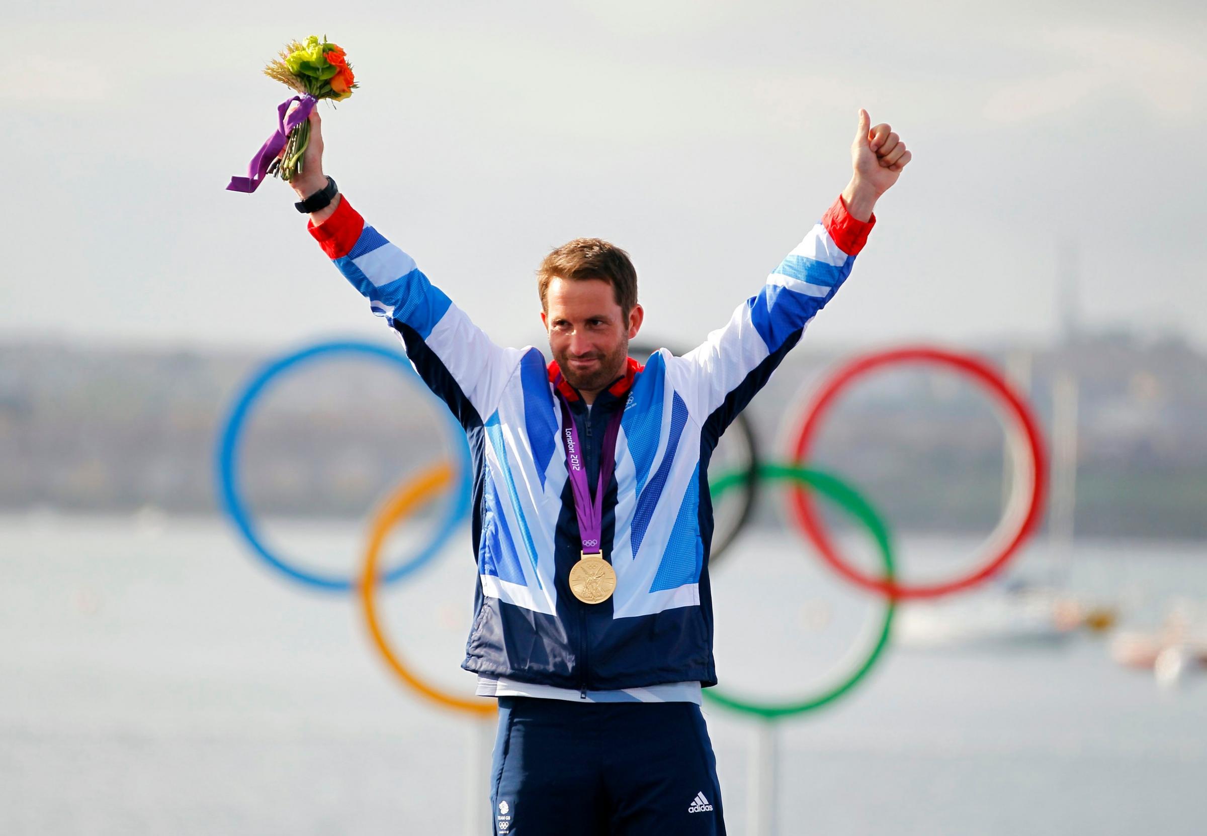 Great Britains Ben Ainslie celebrates on the podium after winning the Gold medal in the Finn class sailing in Weymouth, during day nine of the London 2012 Olympics. PRESS ASSOCIATION Photo. Picture date: Sunday August 5, 2012. See PA story Olympics
