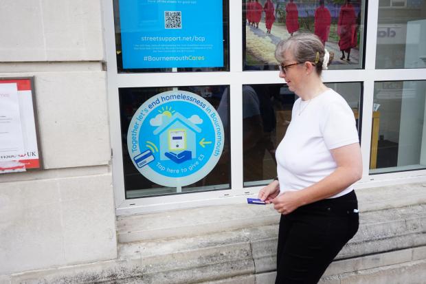 Bournemouth Echo: Councillor Hazel Allen, Lead Member for homelessness and rough sleeping at BCP Council making a donation at the contactless giving point outside the HSBC branch at Beale Place