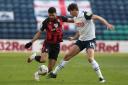AFC Bournemouth's Dominic Solanke (left) and Preston North End's Jordan Storey battle for the ball during the Sky Bet Championship match at Deepdale, Preston. Picture date: Saturday March 6, 2021. PA Photo. See PA story SOCCER Preston. Photo