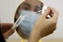 Swab collected for coronavirus test. Picture: PA