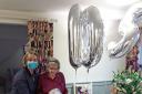Holding her cake, Madeline Gates celebrates her 105th birthday at Colten Care’s Belmore Lodge in Lymington with her friend Sandra Glandwell, left, and fellow resident Mary Malcolm