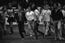 Trouble on the pitch. The faces of those pictured have been blurred.