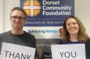 Dorset Community Foundation development manager Gareth Owens and grants manager Ellie Maguire with a message for donors