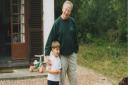 Sam Faulkner is walking the distance in memory of his father who died last year (pictured: Sam during childhood with his father)