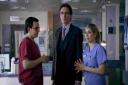 Actor Guy Henry, centre, in Holby City