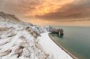 Amateur photographer wins photo competition with this snowy picture of Durdle Door