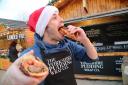 A food tour of the Bournemouth Christmas Market. .Giles Tatton-Bennett on The Yorkshire Pudding Wrap stall. ..