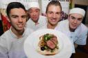 CHAMPION: Winner of the Christchurch Food Festival Young Chef of the Year competition, Jack Stoner, centre, with his winning dish and runners-up, from left, Ryan Proudley, Raymond Pang and Ryan Carpenter