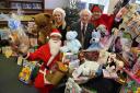 Phil Carey and Daily Echo staff with donations to the toy appeal