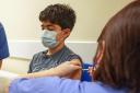 Xavier Aquilina, aged 11, has a Covid-19 vaccination at the Emberbrook Community Centre for Health, in Thames Ditton, Surrey. Photo via PA.