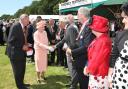 25 July 2012 - The Queen pictured during her visit to the New Forest Show - the Queen meeting dignitaries and organisers