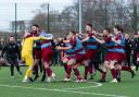 Hamworthy players celebrate victory after the FA Vase quarter-final tie between Hamworthy United and Southall on Sat 12th March 2022 at The County Ground, Hamworthy, Dorset. Photo: Ian Middlebrook.