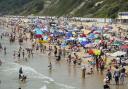 People enjoying Bournemouth beach on Tuesday, July 19 (PA)