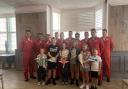 The children pictured among the Red Arrows Pilots