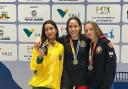 Isabella Haynes (centre) took gold in the 200m freestyle out in Brazil