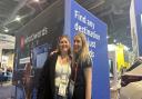 Ellen Stokes, left, and client on the what3words stand in Vegas