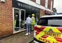 Emergency services responded to Reports of a woman who accidentally reversed into Westover Gallery with her Toyota Yaris.