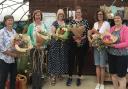 Workshop participants with completed flower fix bouquets,
