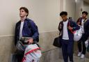 United States' Christian Pulisic, left, Tyler Adams, center and Ricardo Pepi, right arrive with teammates for the World Cup soccer tournament in Santa Ana, Calif. (AP Photo/Caroline Brehman)